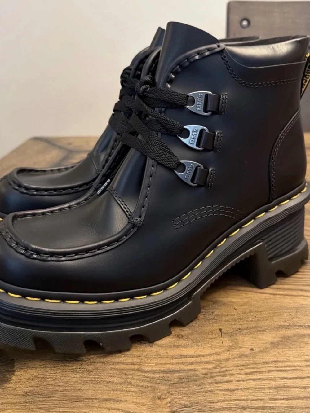 Dr. Martens Black Leather Lug-Sole Ankle Boots with Yellow Stitching